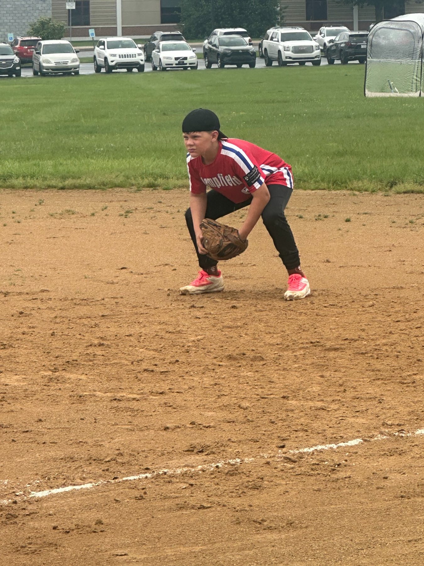 Nathanael fielding in a red jersey