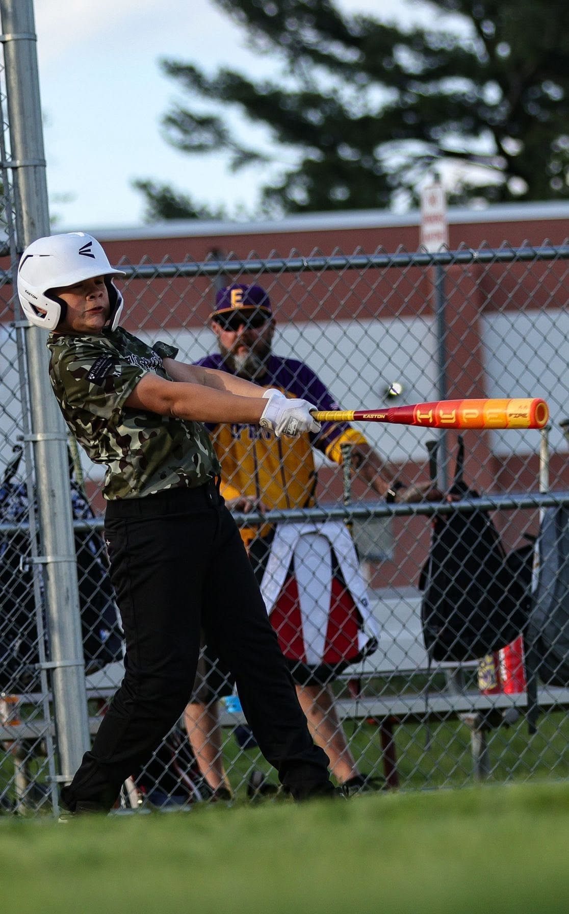 Nathanael making contact during a baseball game