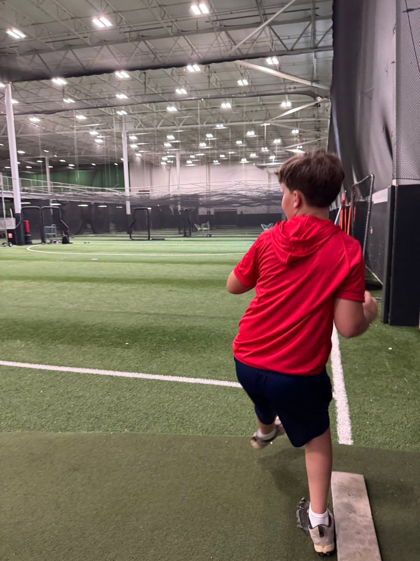 Nathanael training indoors as a pitcher