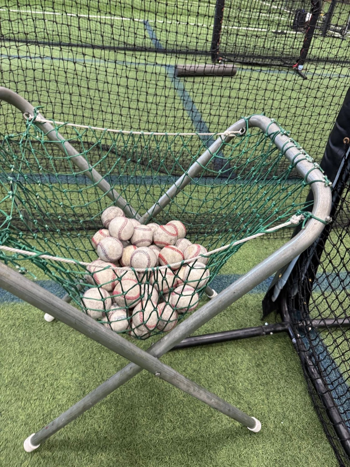 Basket of baseballs during a training session